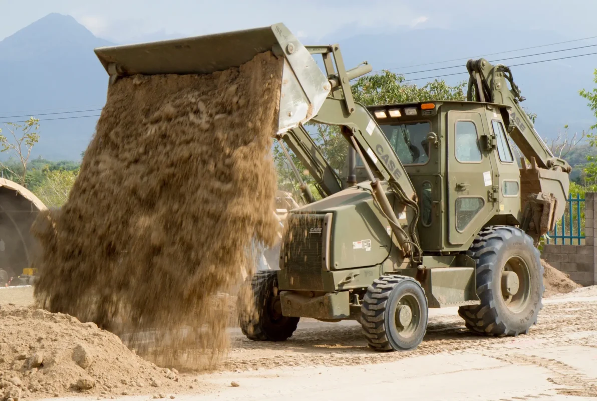02国外项目成功案例展示-Overseas Construction Machinery Project Cases Backhoe loader working on an overseas construction site